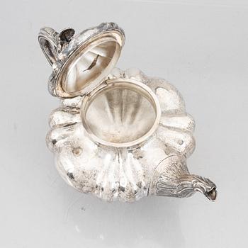 A Swedish Silver Rococo-Revival Teapot, mark of Gustaf Teodor Folcker, Stockholm 1852.