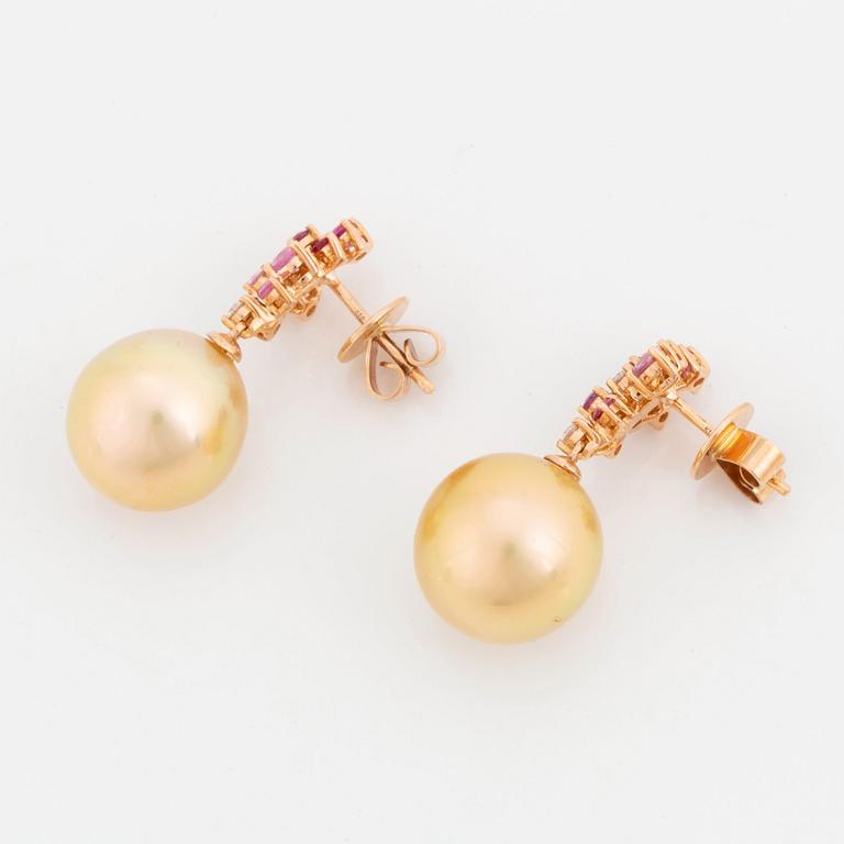 A pair of 18K rose gold cultured South Sea pearl earrings.