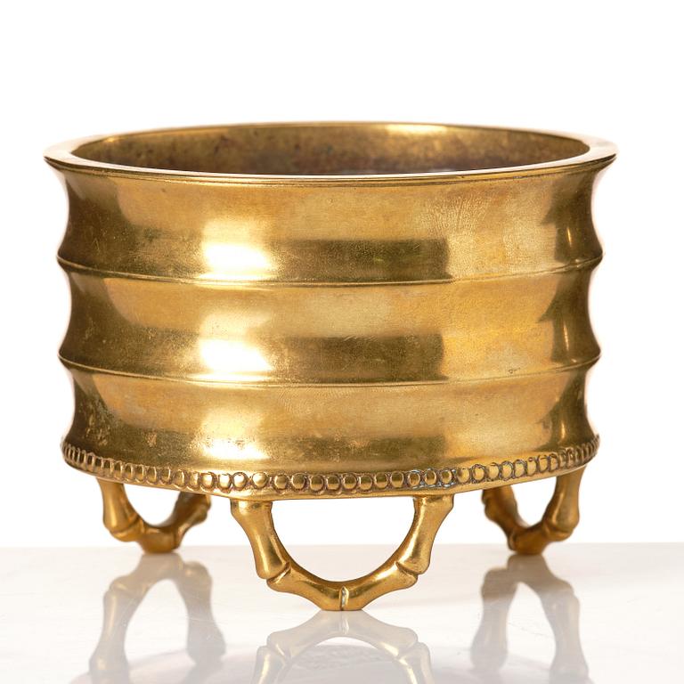 A gilt bronze tripod censer, Qing dynasty, possibly 18th Century.