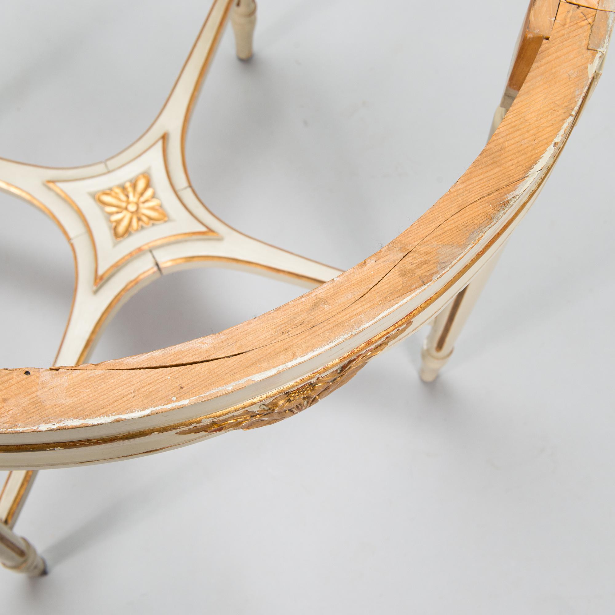 A Gustavian style sofa and table from early 20th century.