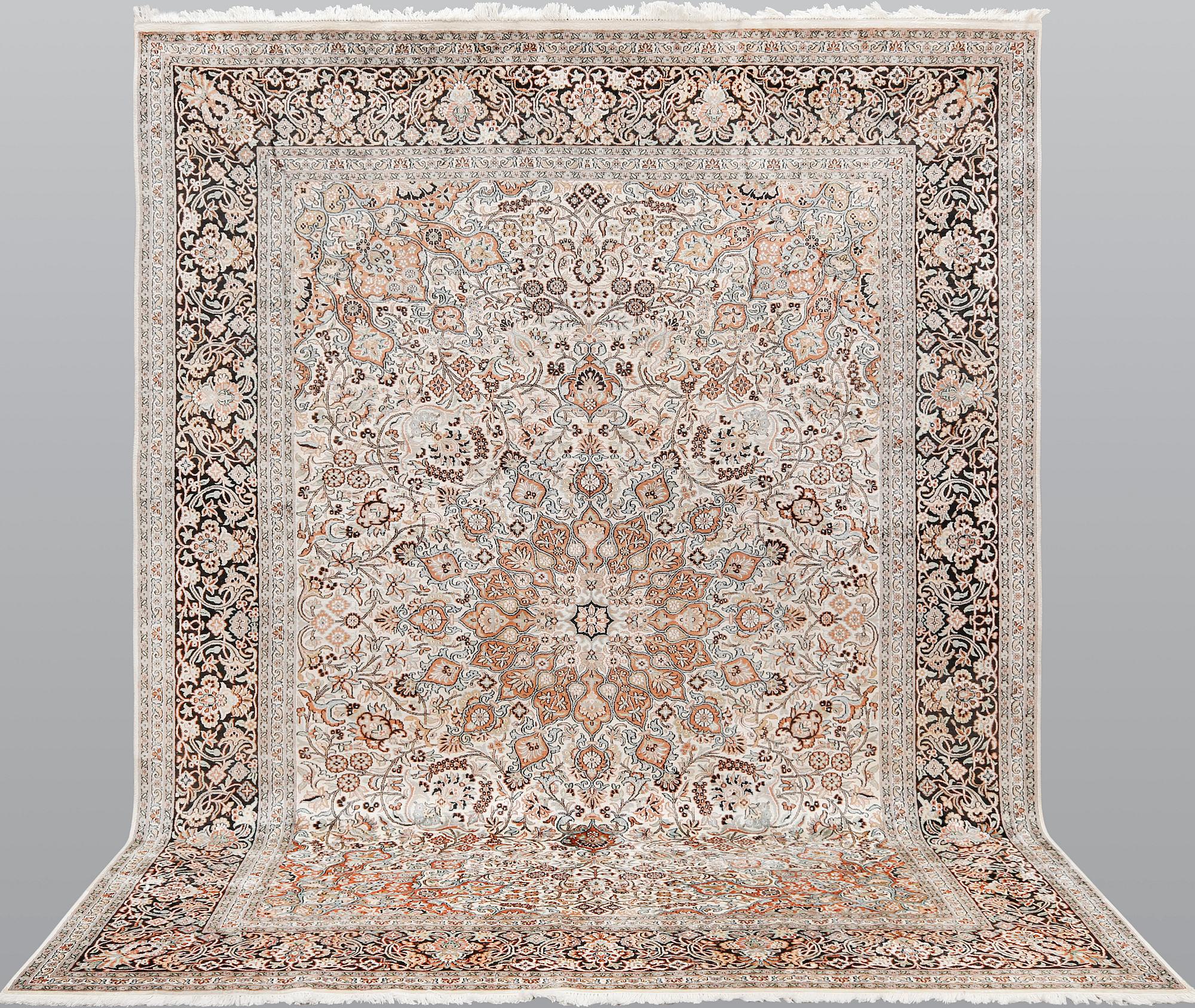 A silk Kashmir carpet, ca 330 x 246 cm.