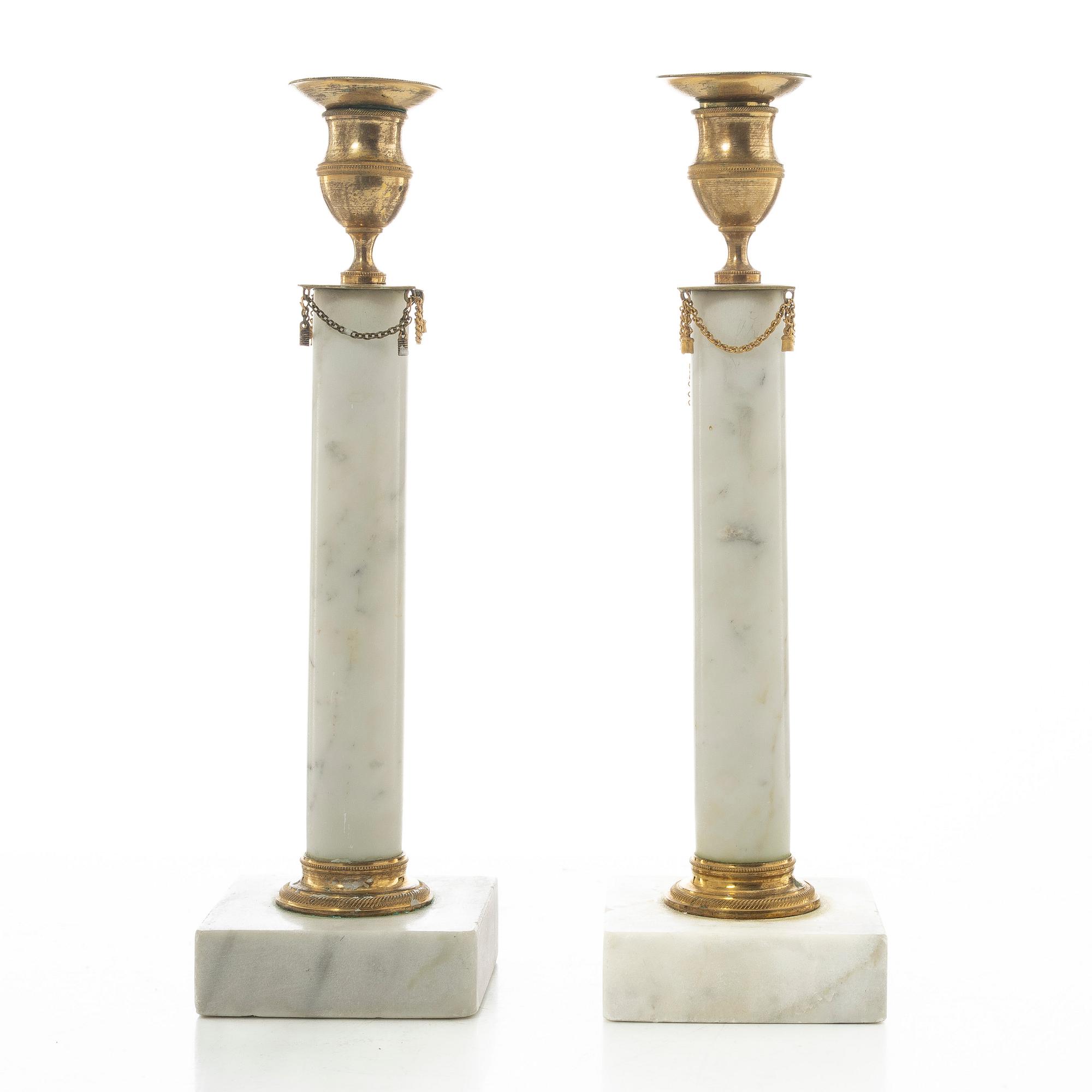 A pair of late Gustavian gilt brass and marble candlesticks, circa 1800.