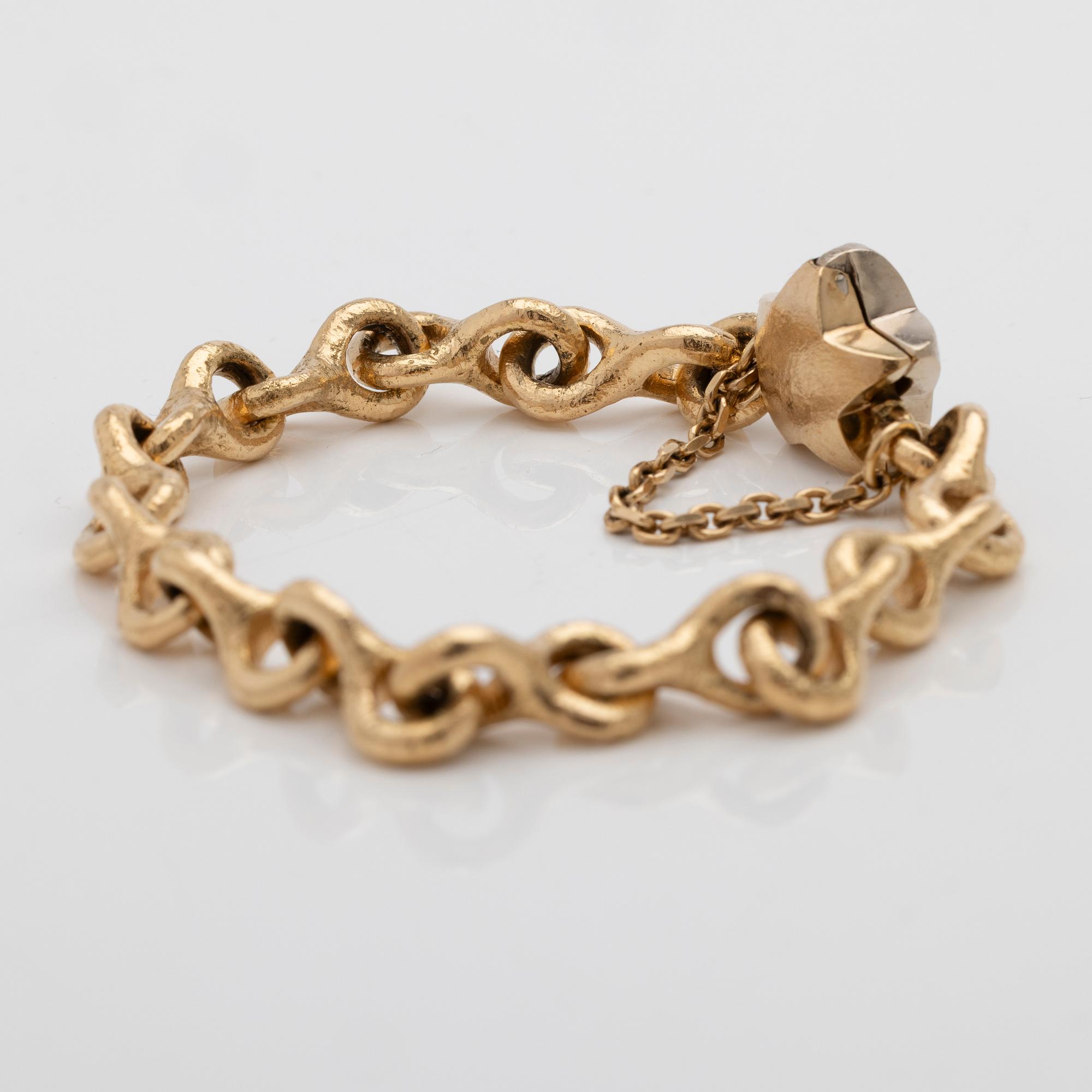 Armband 18K guld med en diamant.