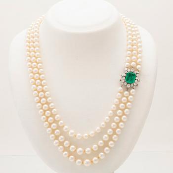 W.A. Bolin, a cultured pearl necklace with an 18K white gold clasp set with an emerald and diamonds, Stockholm 1960.