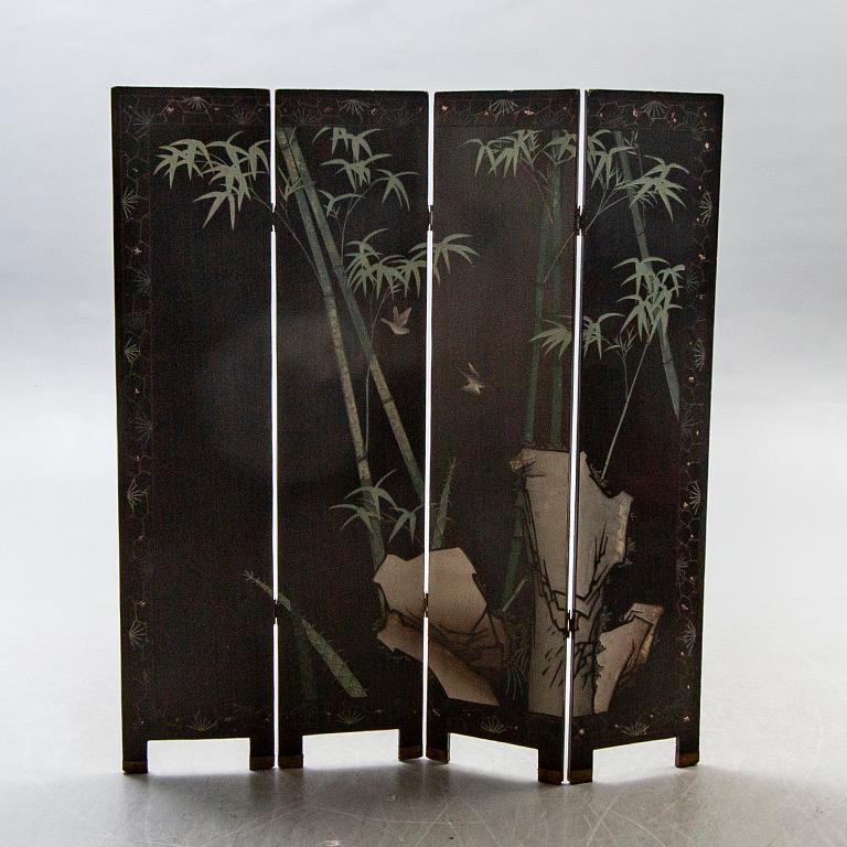 A Japanese 20th century lacquered folding screen.