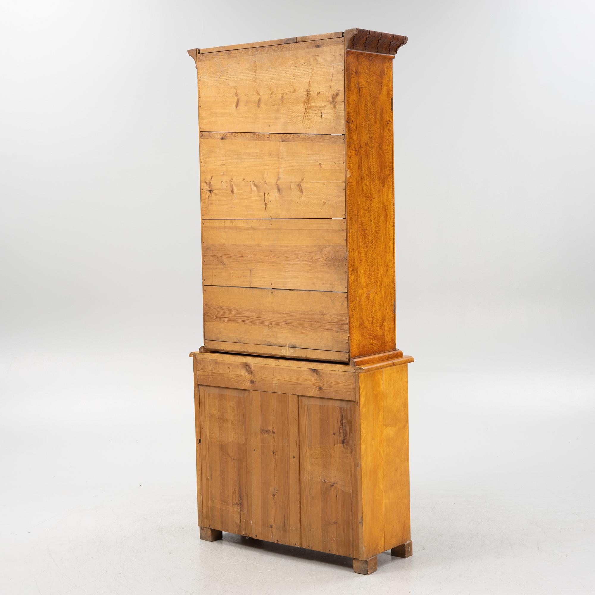 A birch wood veneered book cabinet early 20th Century.