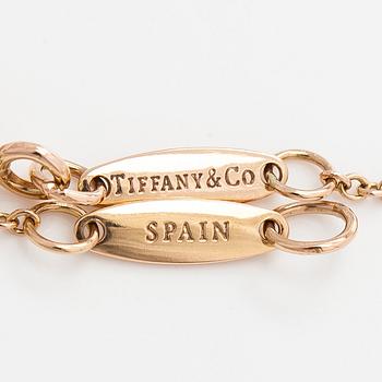 Tiffany & Co, an 18K gold 'Diamonds by the Yard' bracelet with a brilliant-cut diamond.