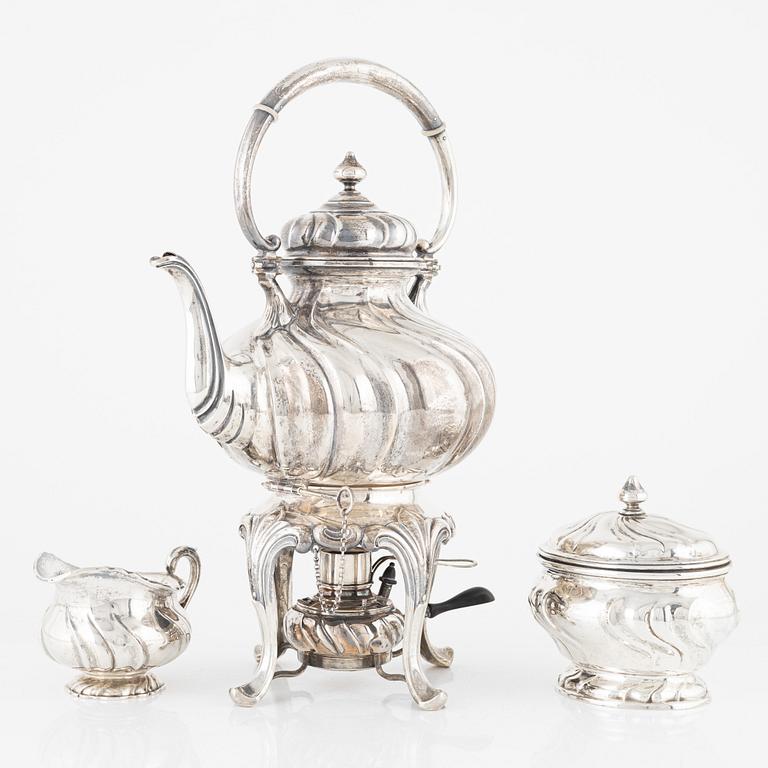 A Swedish 20th century silver tea-urn with stand and burner, creamer and sugerbowl, Stockholm 1918-1920.