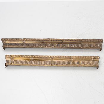 Two repousse-brass cornices, circa 1900.