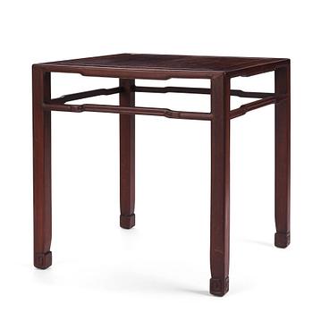 1015. A Chinese hardwood corner-leg table, Qing dynasty.