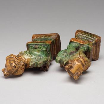 A pair of green and yellow glazed joss stick holders, Ming dynasty (1368-1644).