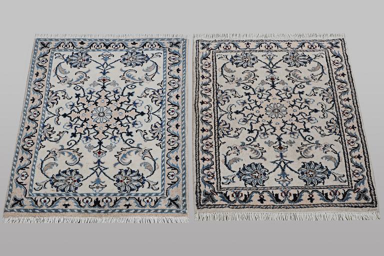 a pair of rugs, Nain, part silk, ca. 80 x 60 cm & ca. 83 x 58 cm.