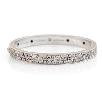 A Cartier "Love" bracelet in 18K white gold set with round brilliant-cut diamonds.