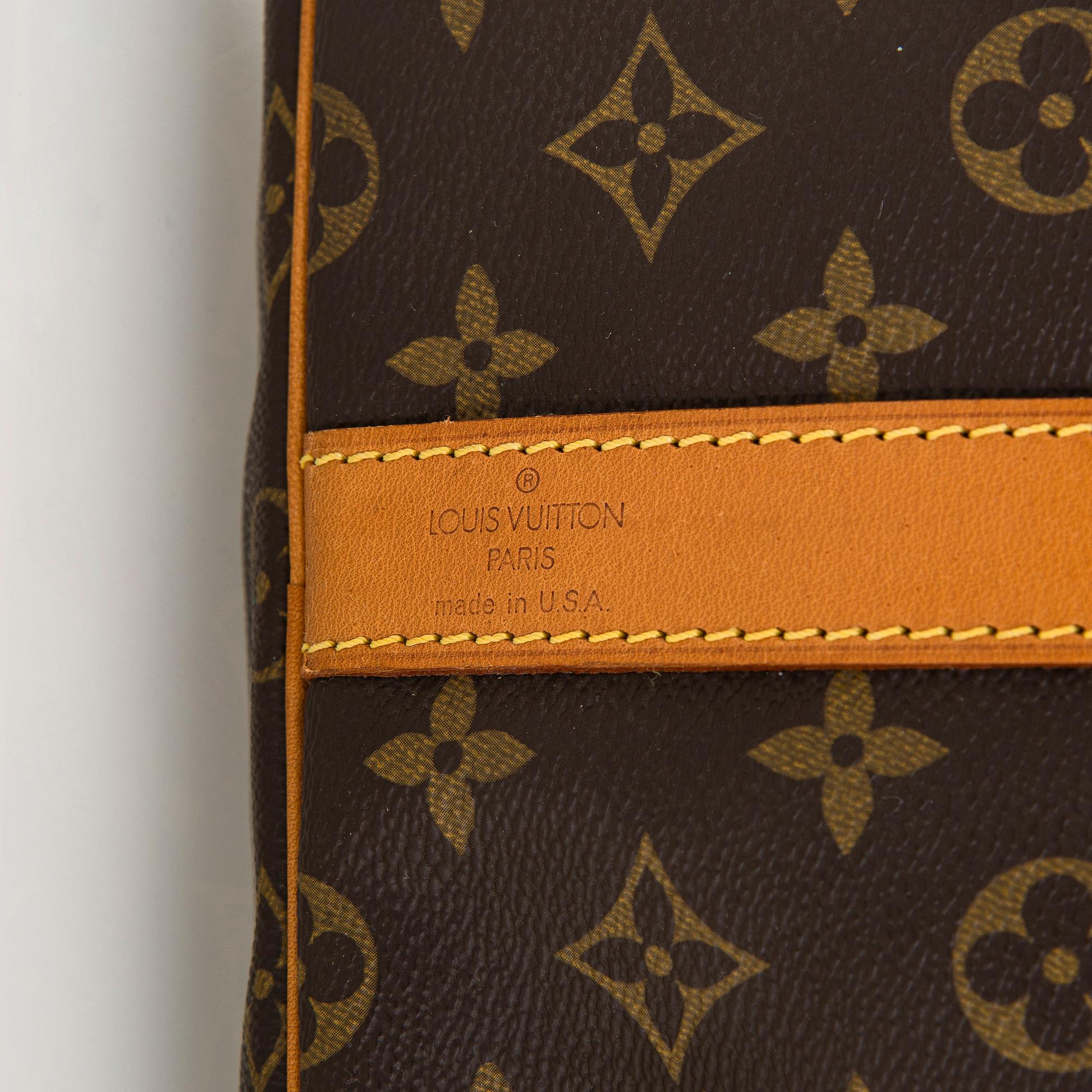 Louis Vuitton, a Monogram Canvas 'Keepall 55 Bandoulière' weekend bag.