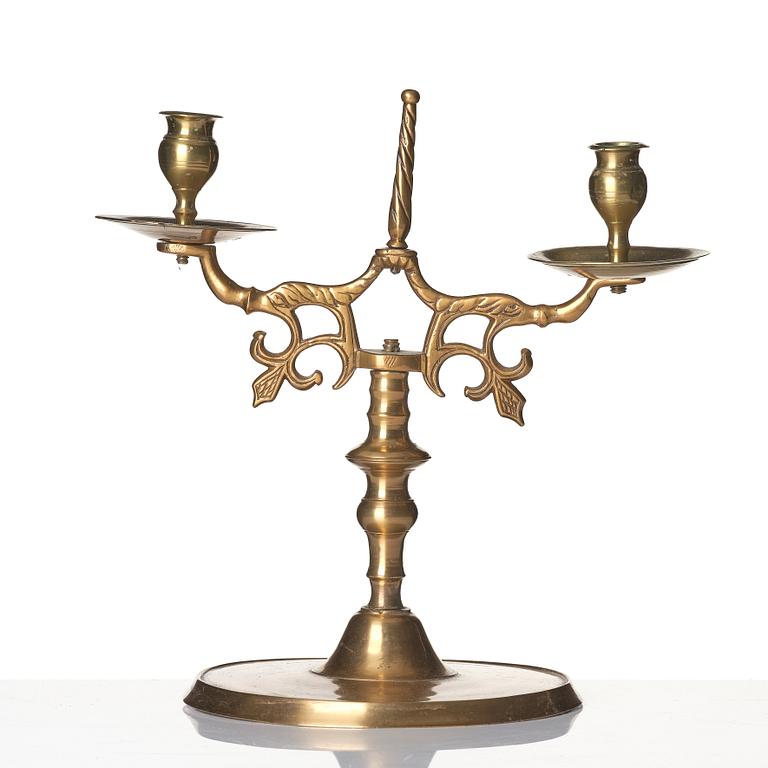 A baroque brass two-branch candelabra, Northern Europe/Sweden, 17th century.