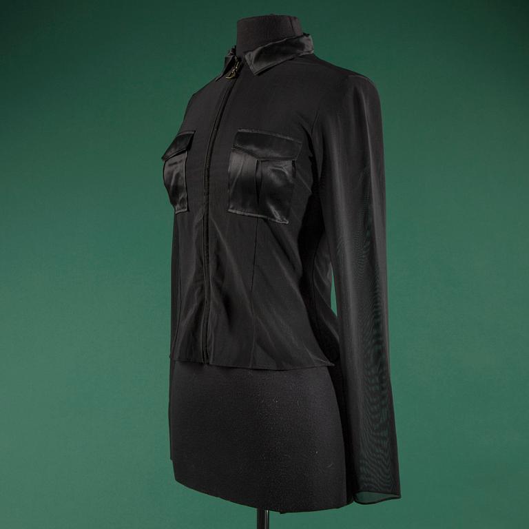 A blouse by  CHRISTIAN DIOR, in size 40(FR).