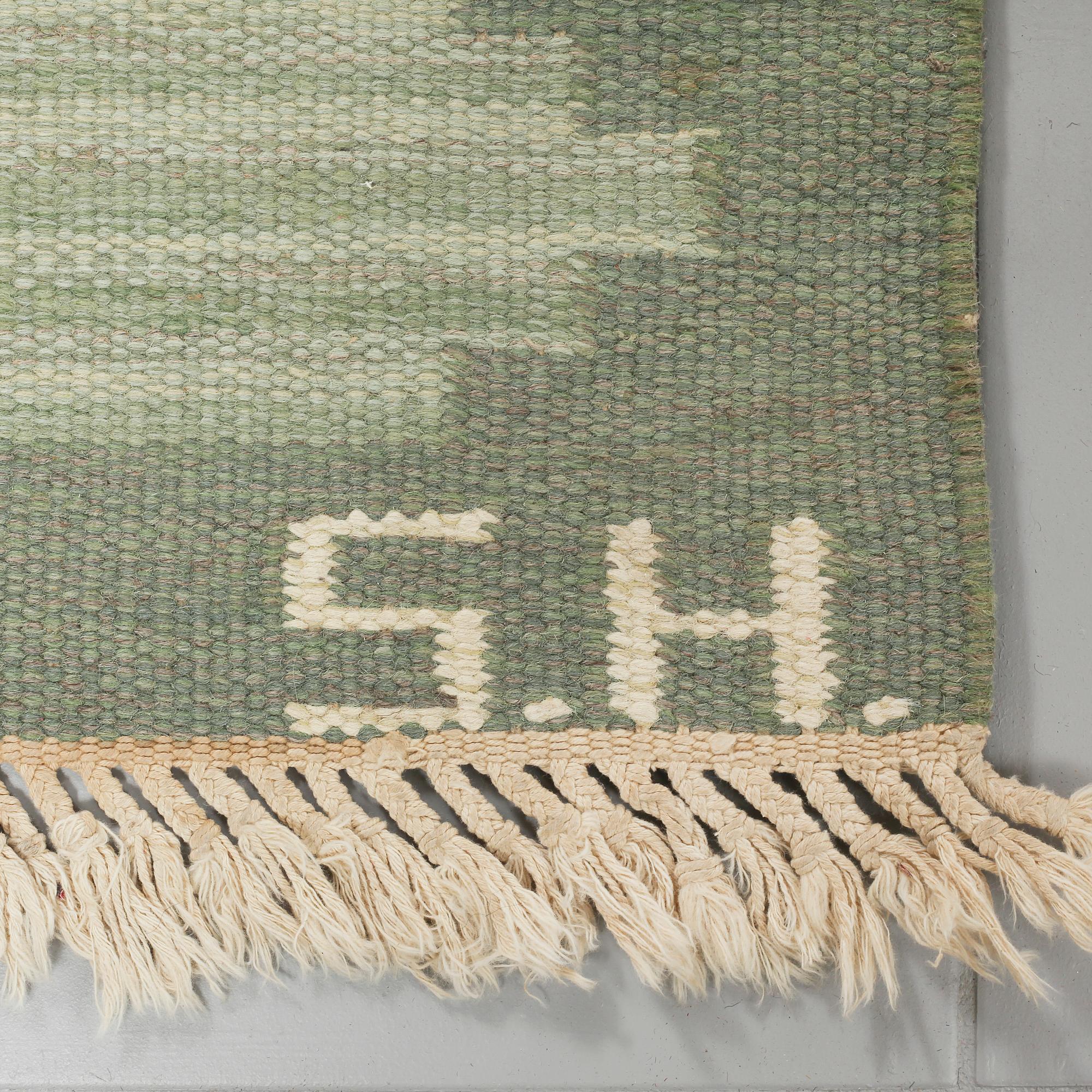 A SWEDISH FLATWEAVE, SIGNED SH, 230 x 165 cm.