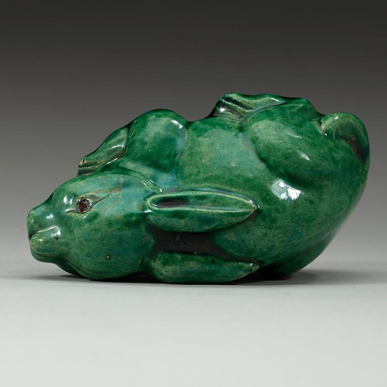 A green glazed figurine, Qing dynasty (1644-1912).