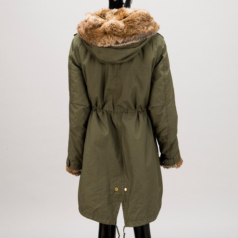 Ladies Woolrich Military Parka in size L.