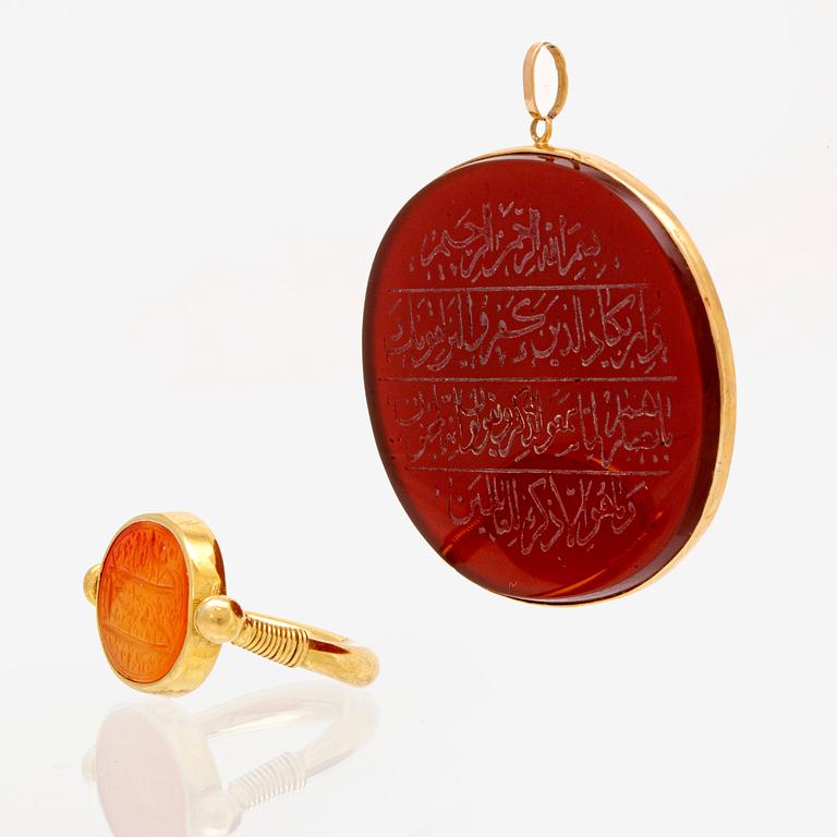 Ring and pendant, 18k and 14K (pendant), carnelian inscribed.