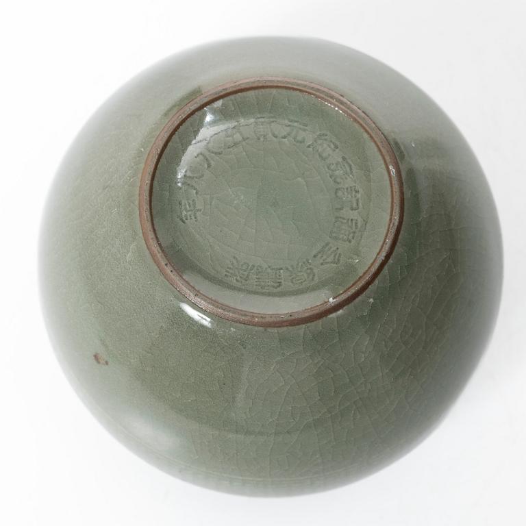 A Korean celadon glazed ceramic vase, 1900s.