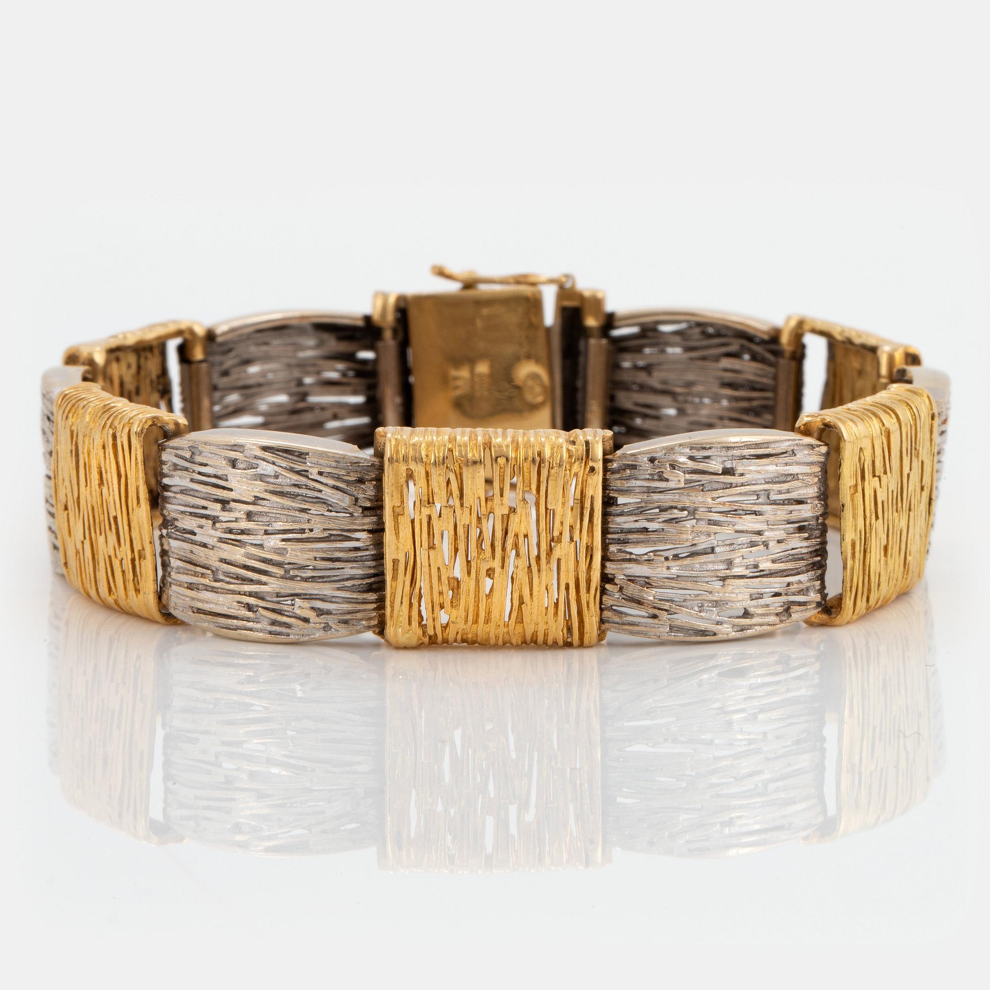 An 18K gold and white gold bracelet.