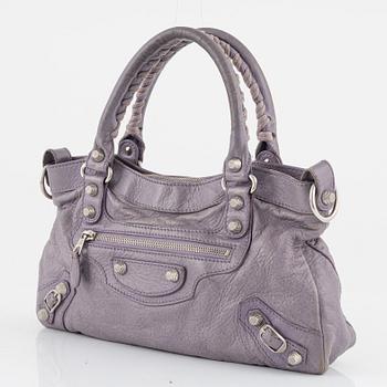 Balenciaga, a purple leather 'City' handbag.