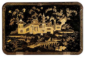 A gold and black lacquer sewing table, Qing dynasty, ca 1800.