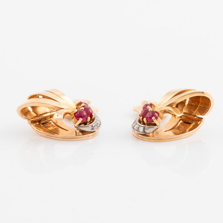A pair of 18K gold WA Bolin earrings set with cabochon-cut rubies and eight-cut diamonds.