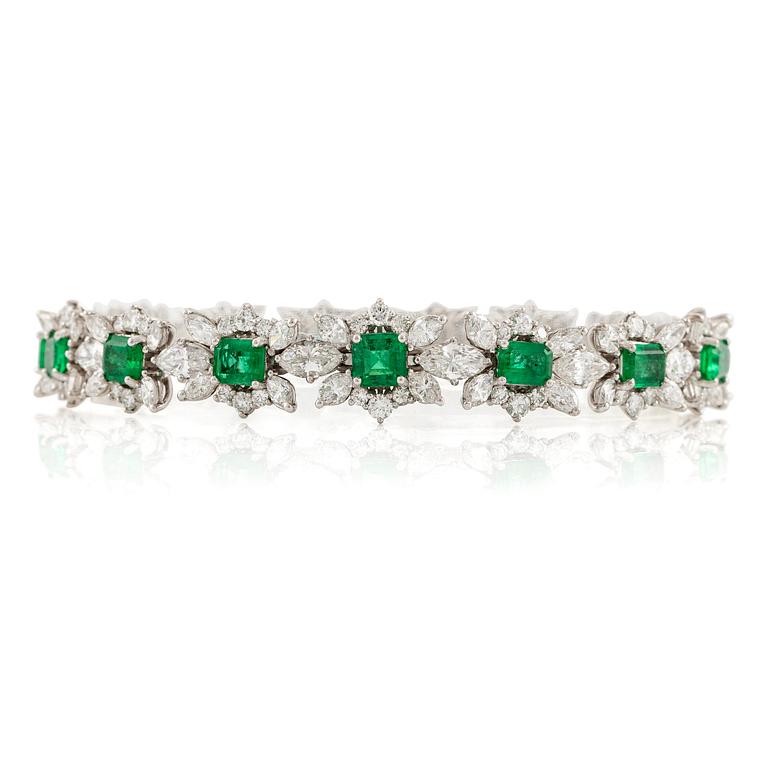 A bracelet in 18K white gold with step-cut emeralds and round and navette-shaped brilliant-cut diamonds.