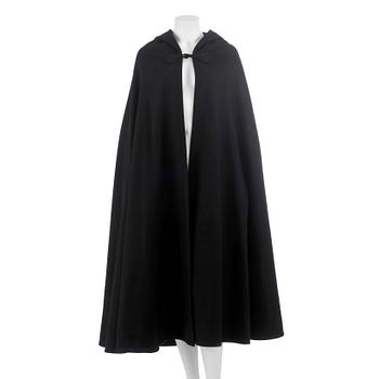 490. YVES SAINT LAURENT, a black wool cape with hood. .
