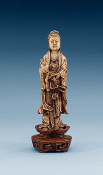 A stone sculpture of Guanyin, Qing dynasty (1644-1912).