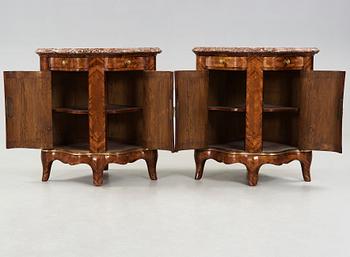 A pair of Louis XV 18th century corner cupboards.