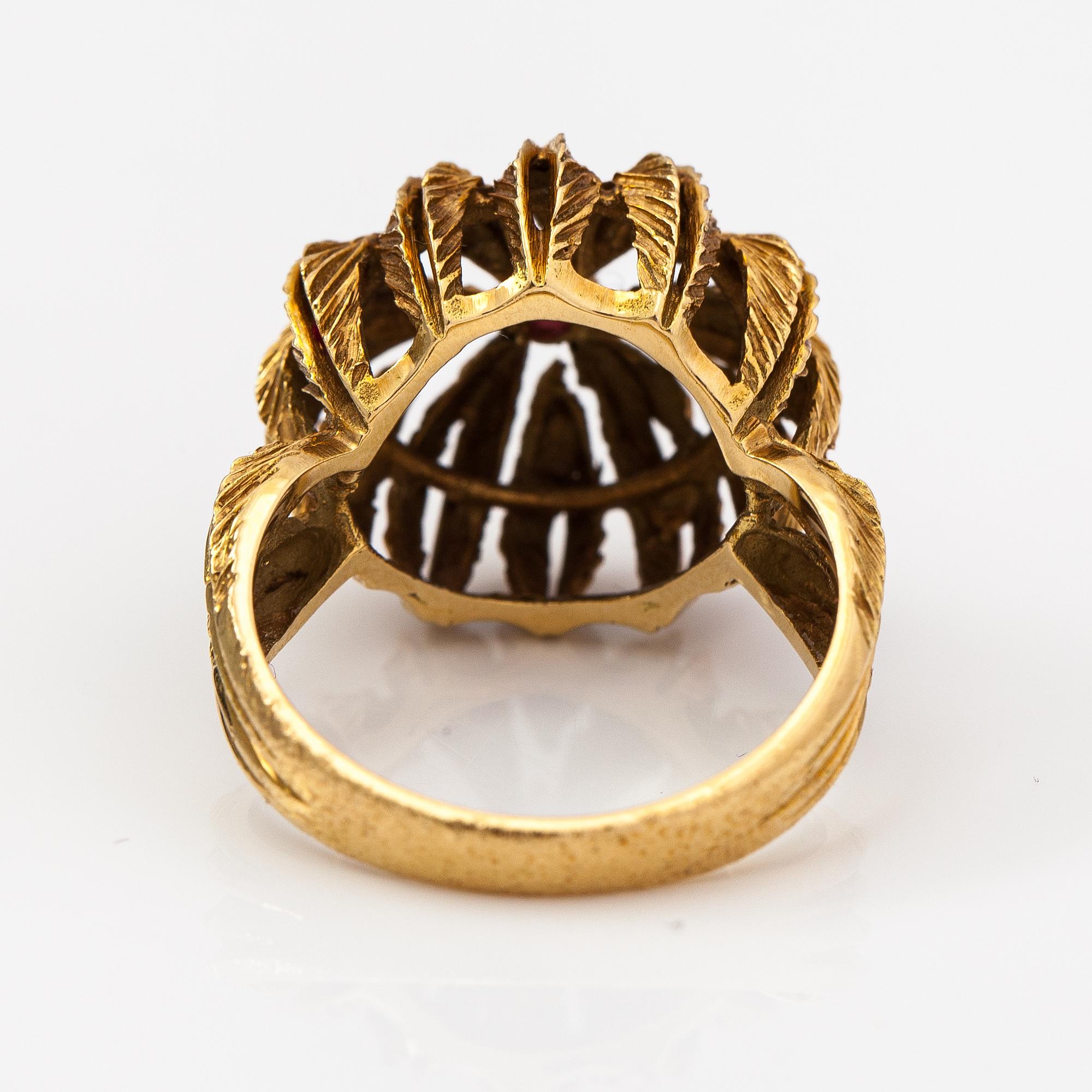 An 18K gold ring with a ruby.