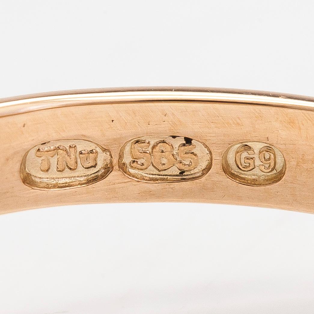 Ring, 14K guld med en modifierad brilliantslipad peridot, Finland 2008.