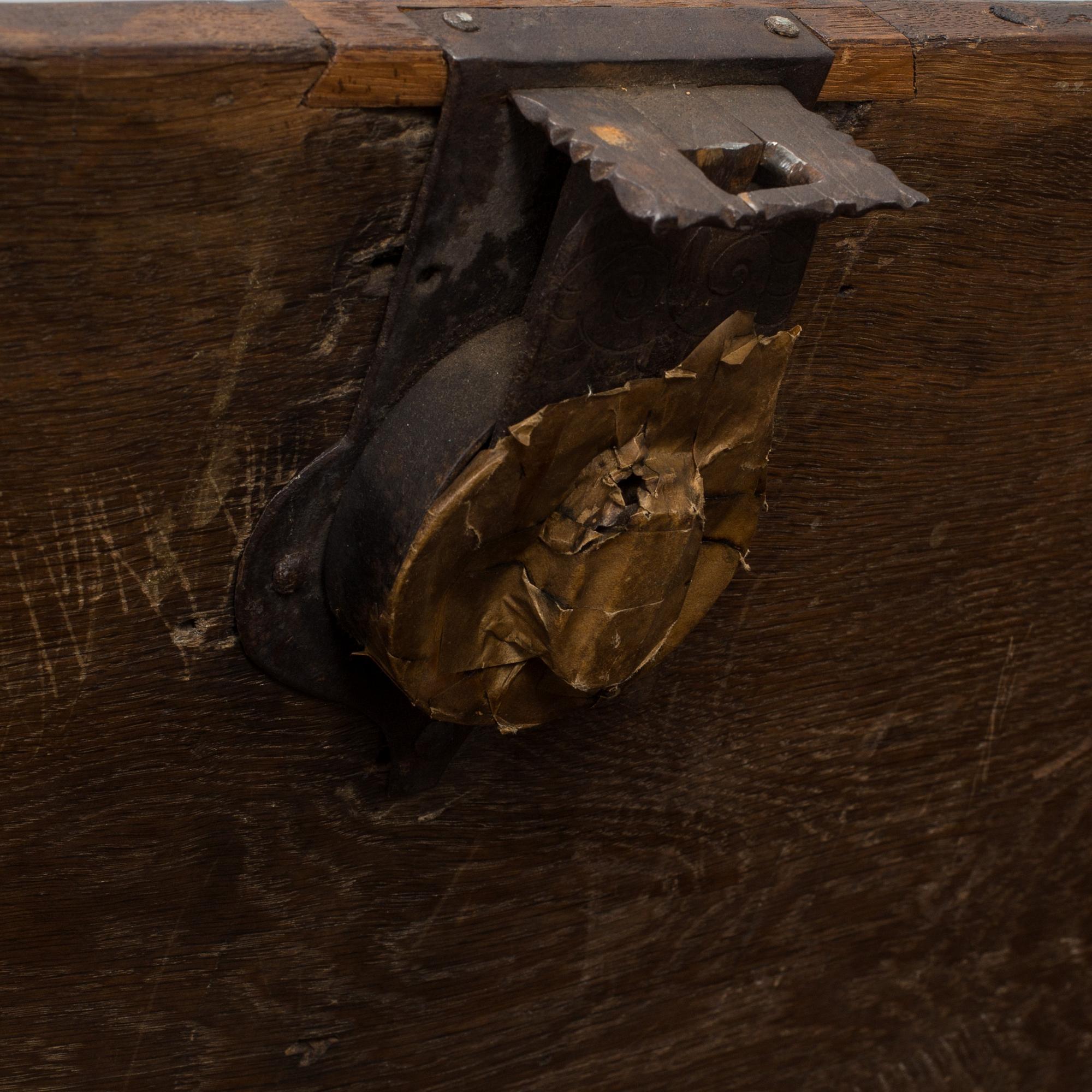 A large 17/17th century baroque oak chest with wrought iron fittings.