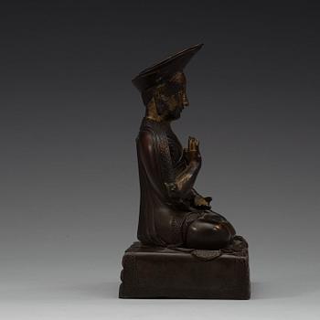 A Sino-Tibetan bronze figure of a Lama, early 20th Century.