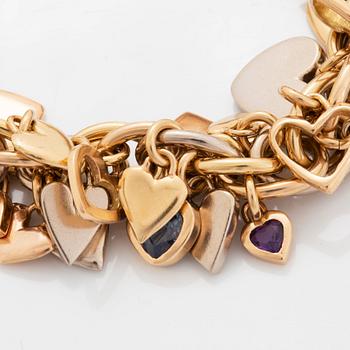 An 18K gold Gaudy bracelet with heart shaped charms.