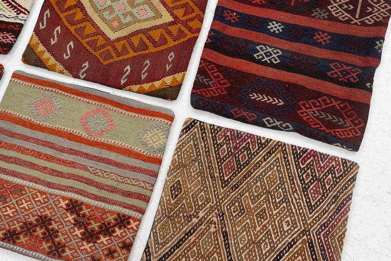Nine Kilim pillow cases and two Kilim pillows, around 1970, ca. 50 x 50 cm.