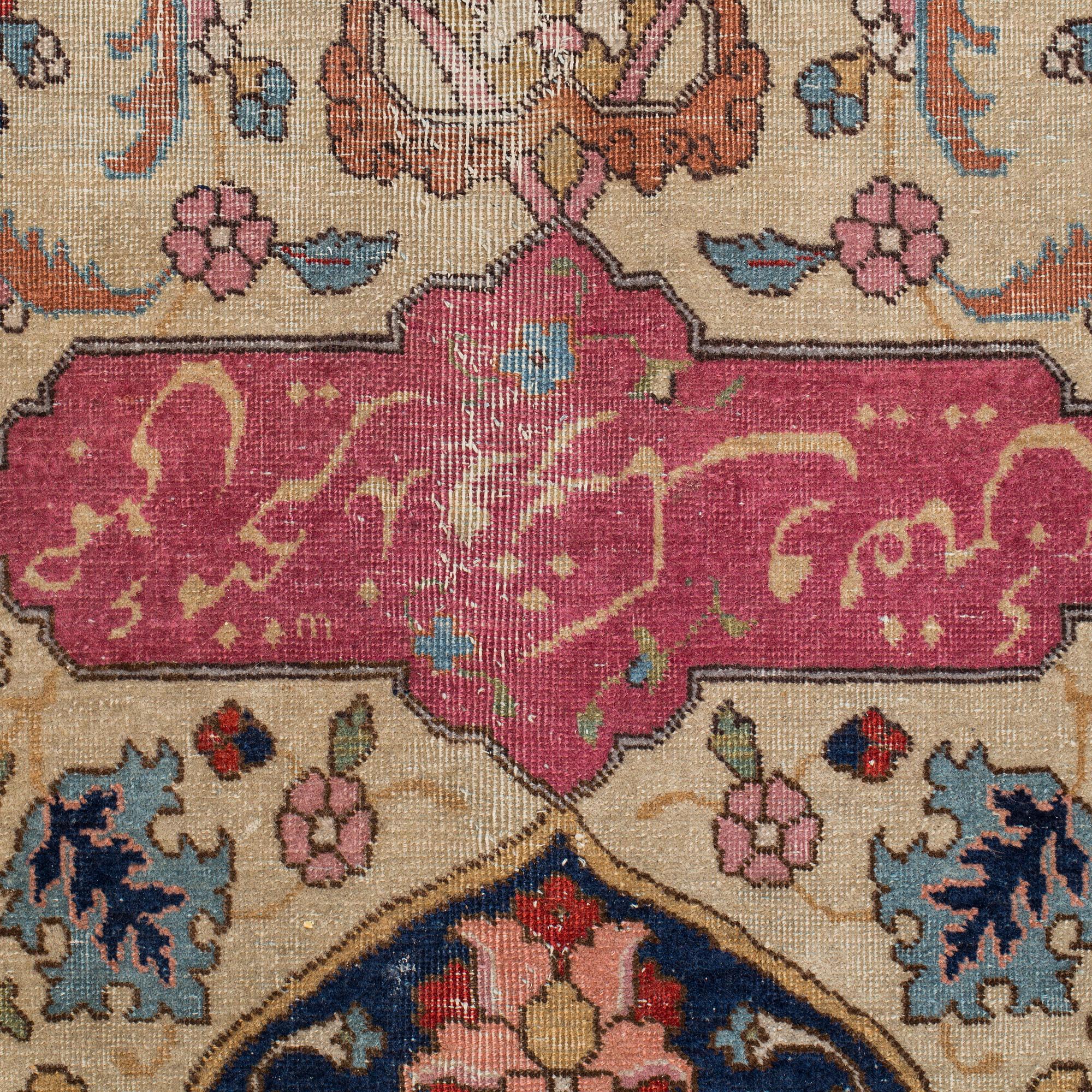 A CARPET, a semi-antique Tabriz, around 422 x 310 cm.