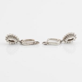 Pear shaped diamond earrings.