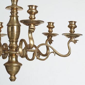 A six-light 18/19th century brass chandelier.