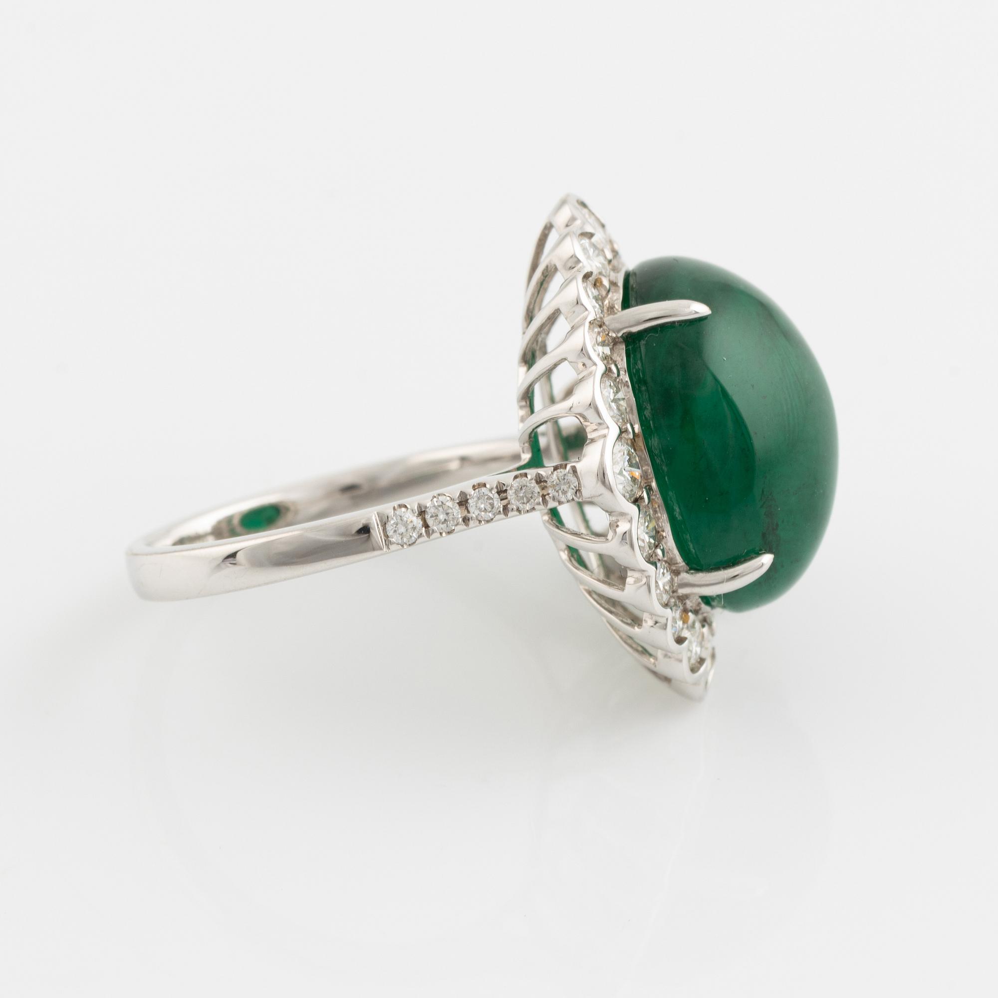 Cabochon cut emerald and brilliant cut diamond ring.
