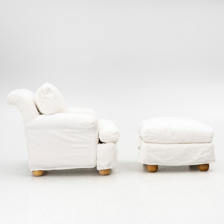 An armchair with ottoman, contemporary.