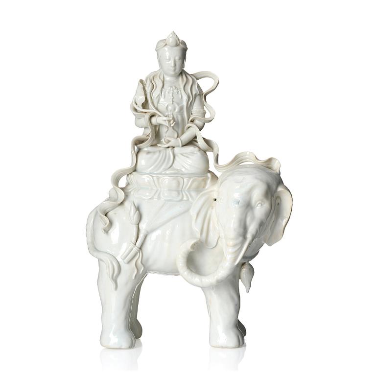 A large blanc-de-chine figure of Guanyin riding an elephant, late Qing dynasty/early 20th Century.