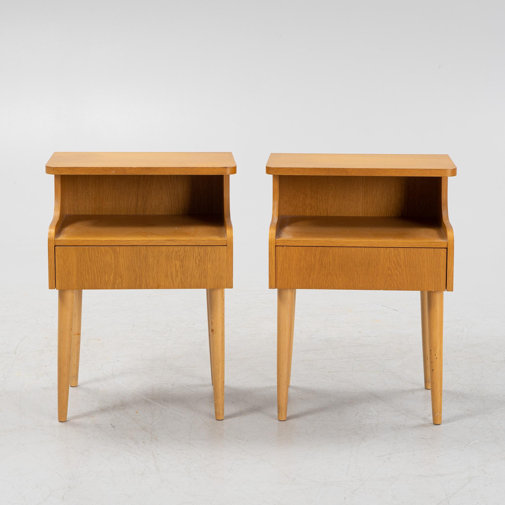 A pair of oak veneered bedside tables, mid 20th Century.