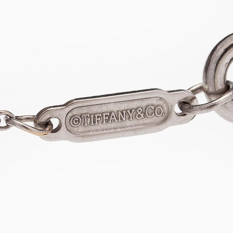 Tiffany & Co, an 18K white gold "Metro Cross" necklace with diamonds.