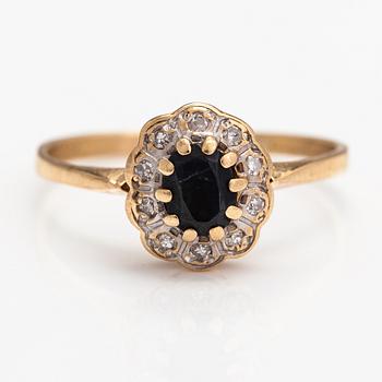 A 14K gold ring with a sapphire and a diamonds ca. 0.10 ct in total.
