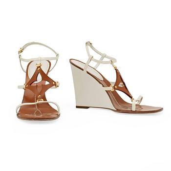 378. LOUIS VUITTON, a pair of white wedge heel sandalettes.