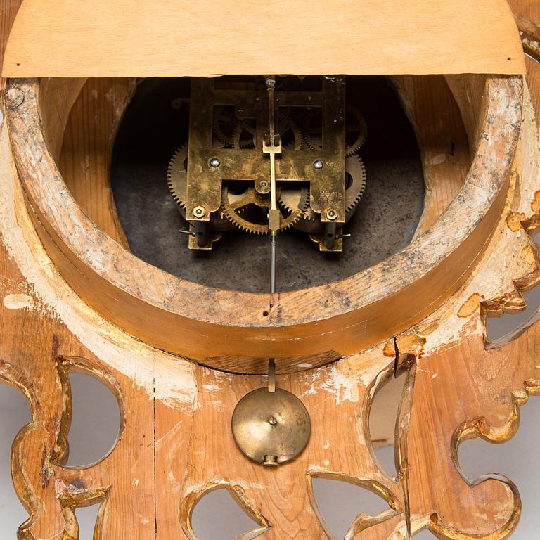 A Rococo style wall clock from first half of the 20th century.